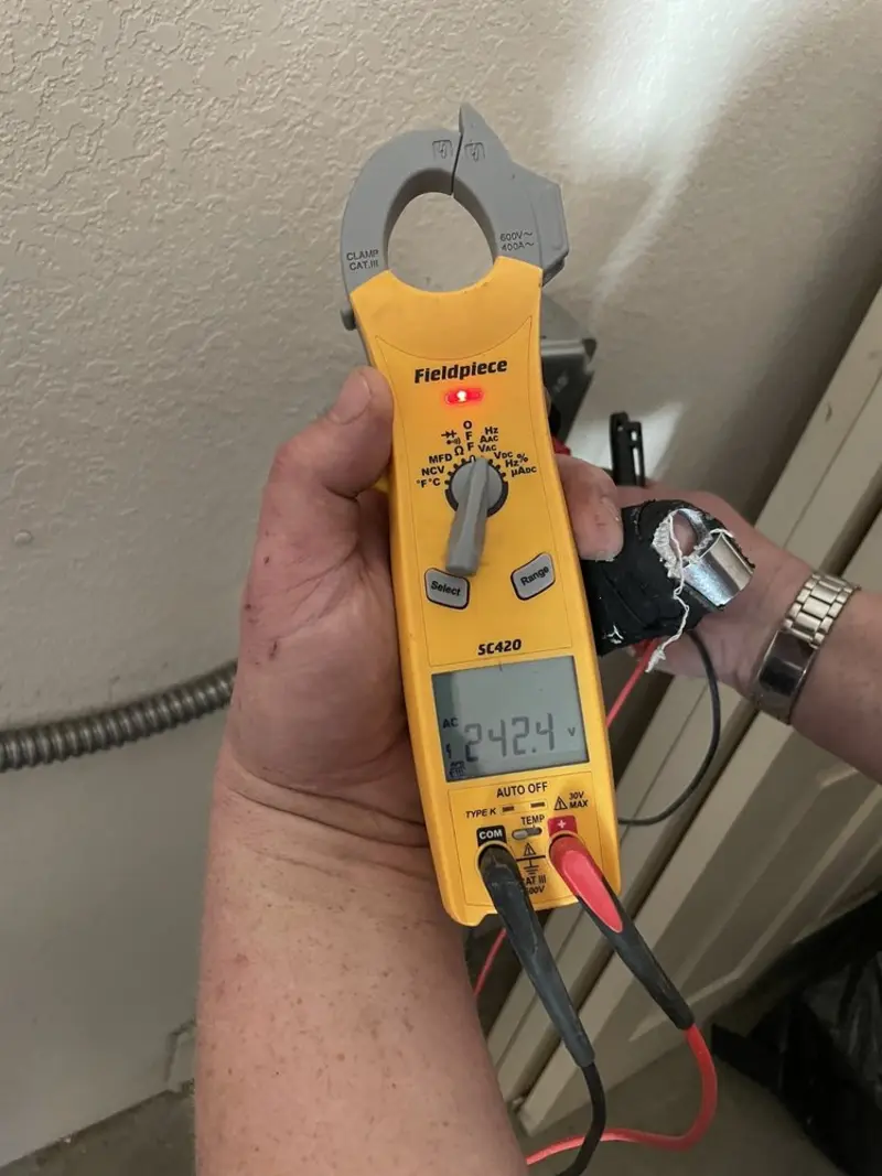Voltage testing with clamp meter during Hot Tub / Pool Electrical Wiring in Orange